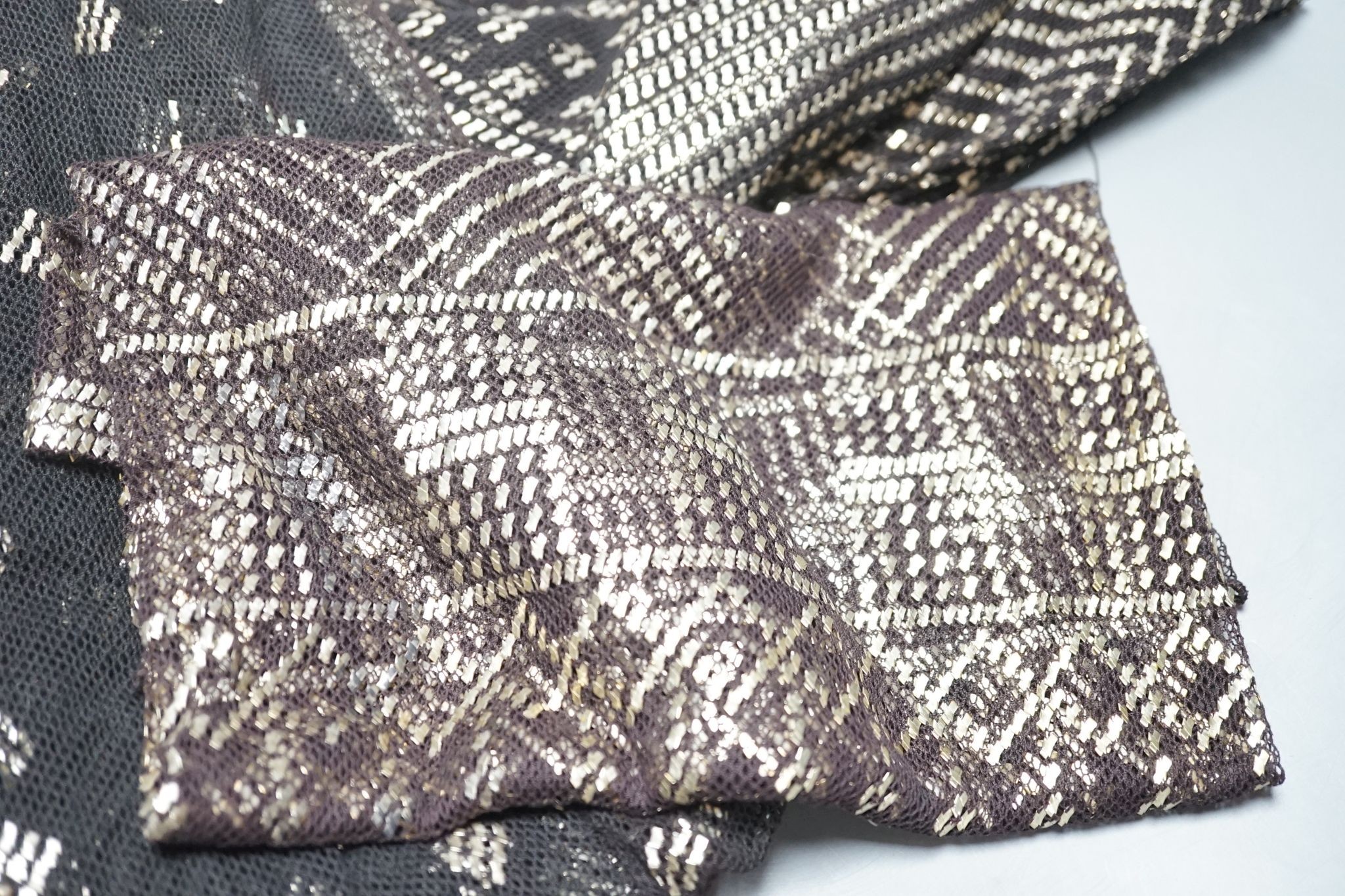 A dress made from a metal and black net Egyptian shawl; a similar shawl and a piece of shawl
